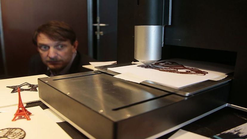A 3-D "chocolate" printer was displayed during the Salon du Chocolat (Chocolate Fair) in Porte de Versailles, in Paris, on October 2015. JACQUES DEMARTHON/AFP/Getty Images